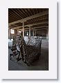 A large open warehouse area with scattered antiques  separates the restaurant from the hotel