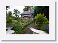 A brick cottage stands at the entrance to the Adrilaun Hotel in the outskirts of Galway