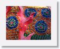 They are made of thousands of medicine vials filled with colored water and tied together