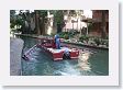 Maintenance boat with hydraulic controlled skimmers clean the river in the early morning.