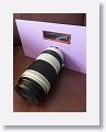 A bit of scrap mat board with a cut out for the lens and a Thousand Oaks Optical solar filter card.