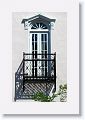 Strong shadows give this balcony an M. C. Escher-like feel